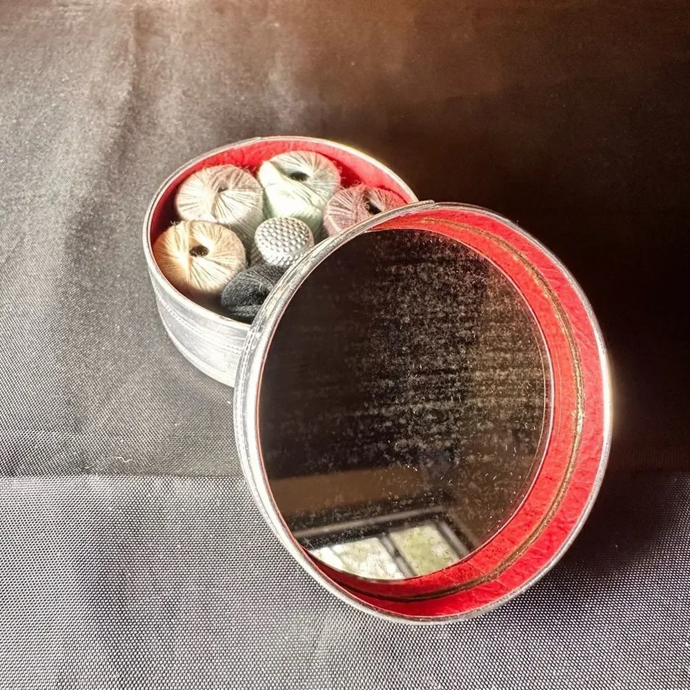 Vintage 1950s round pin cushion sewing tin complete with thread